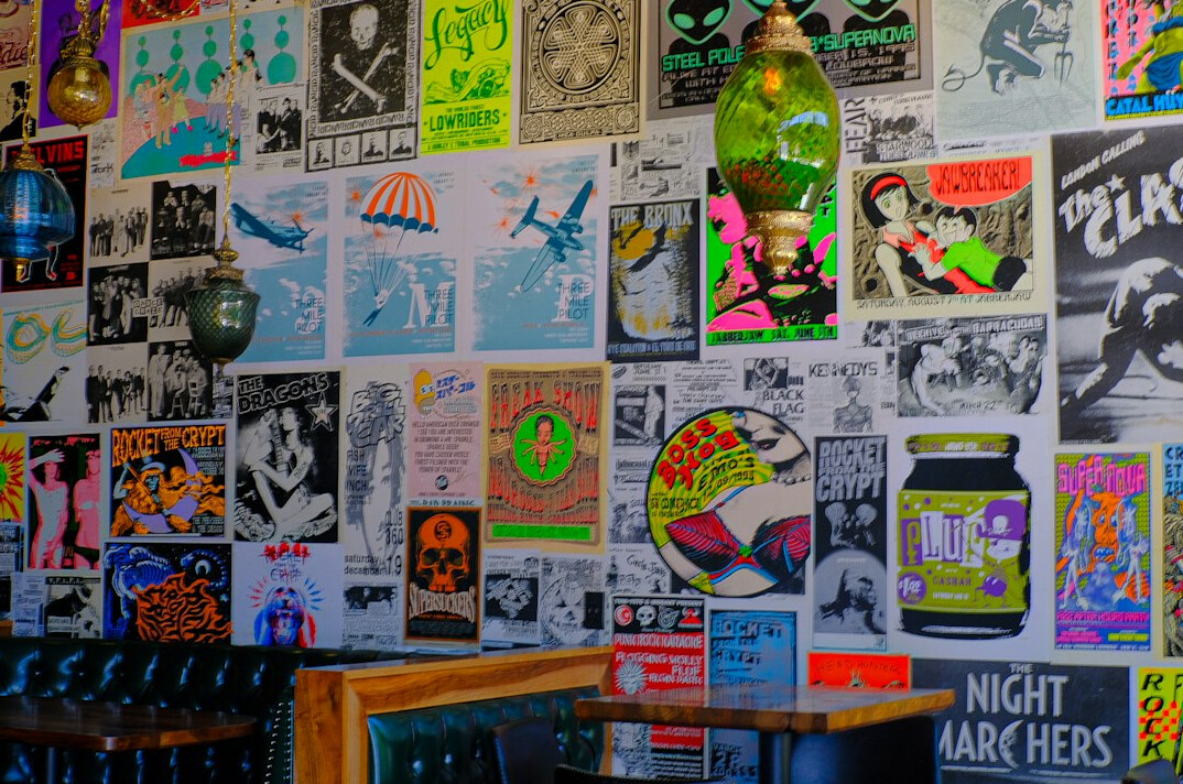 Wall covered with layered vintage advertising posters